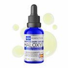 Bottle of Haloxyl serum with dropper on a white background with pale green droplets