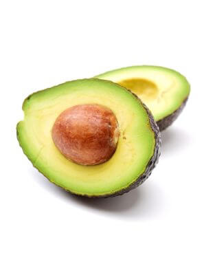 Halved avocado with a glossy seed, revealing its creamy green flesh