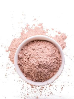 Piles of fine pink kaolin clay, used for creating facial masks
