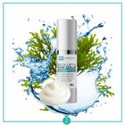 Skincare serum bottle with greenery and water splash on a white background